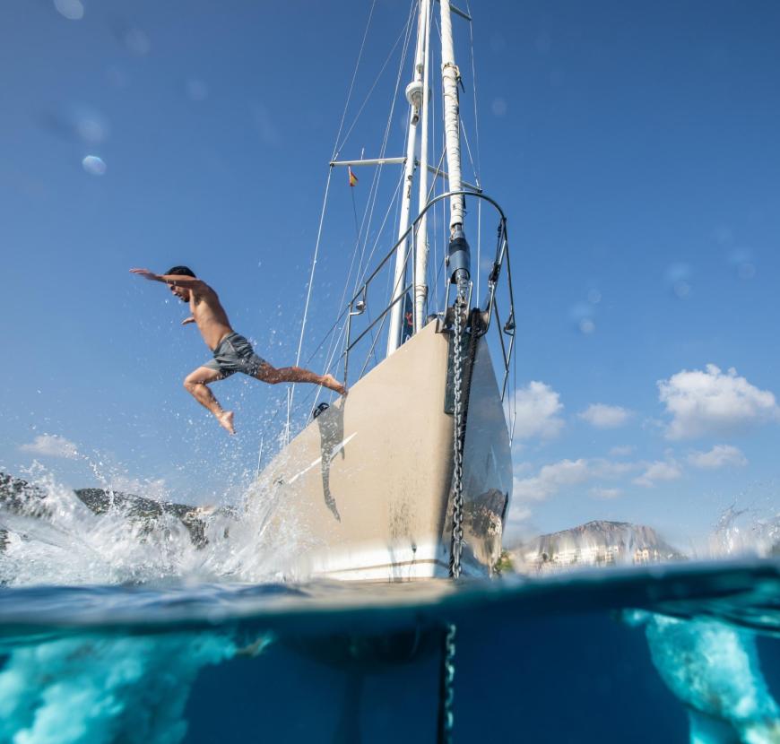 Man jumping off charter yacht v2